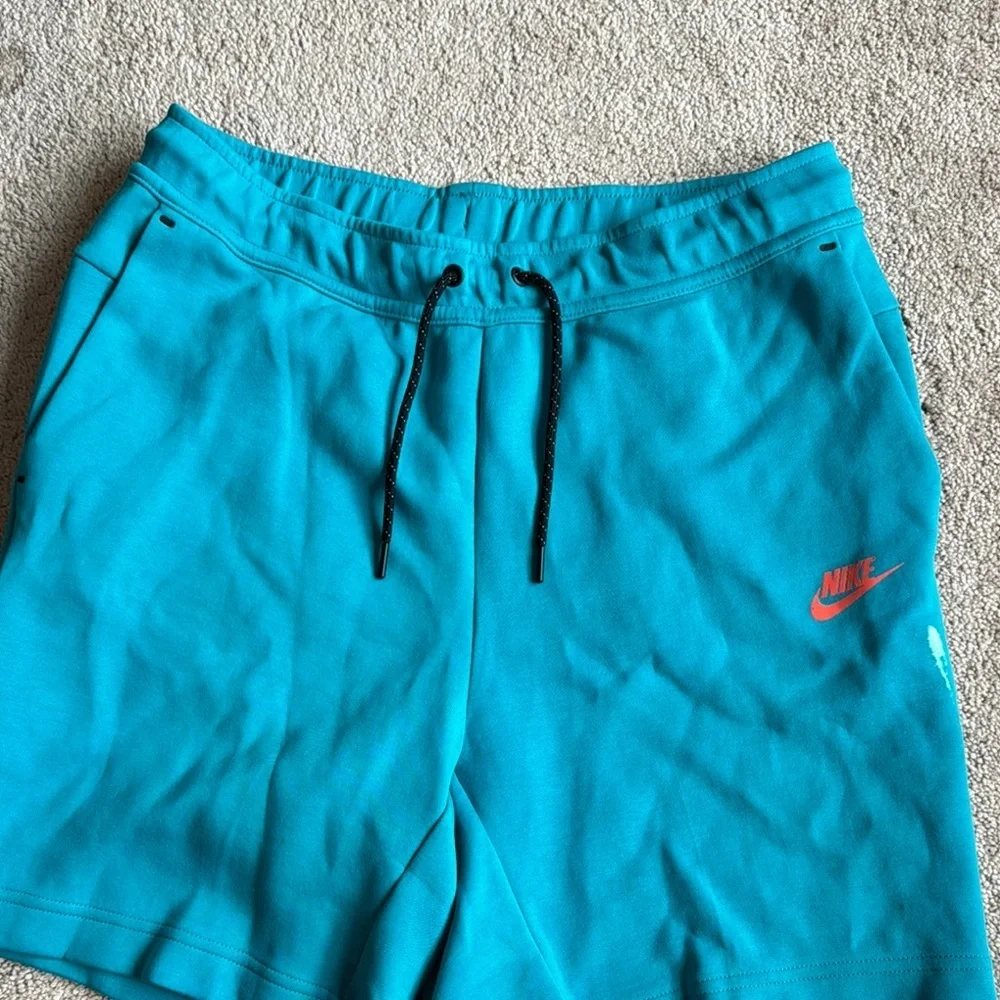 Nike Men's Teal Shorts with Red Logo